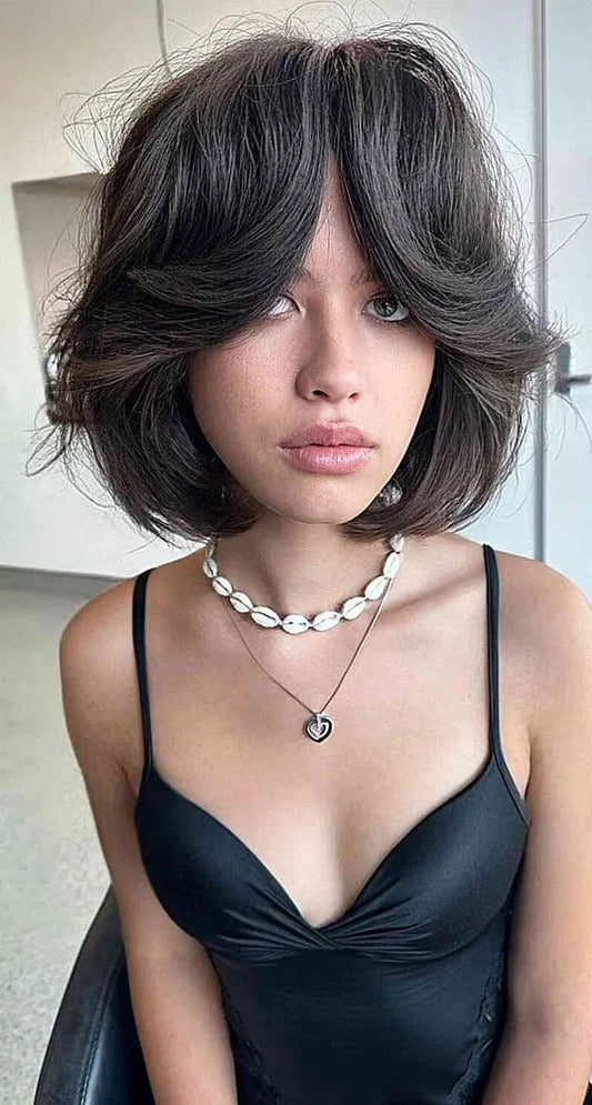Butterfly bob with curtain bangs