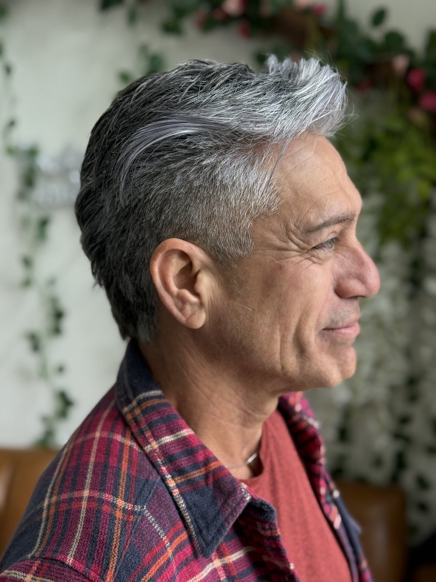 Grey blending by Miles on a smiling silver-haired client at Mahne Roots Collective in Broomfield, CO