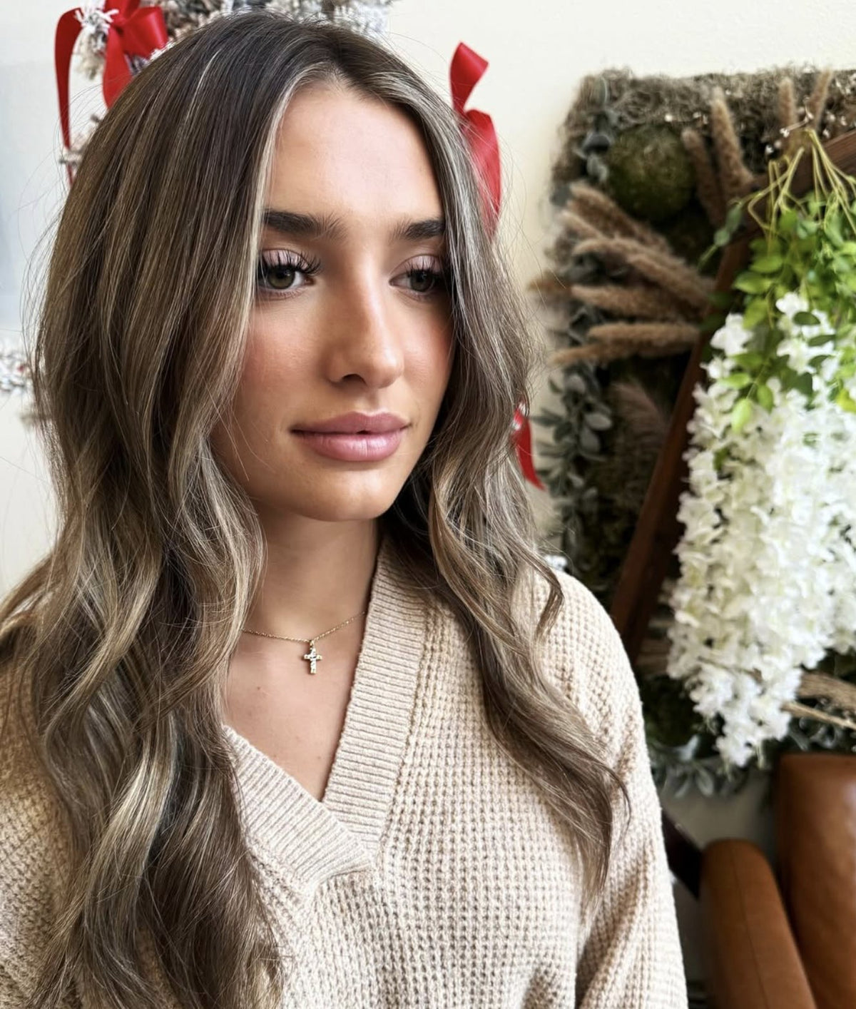Dimensional brunette balayage by Nicole, client facing the camera, at Mahne Roots Collective in Broomfield, CO